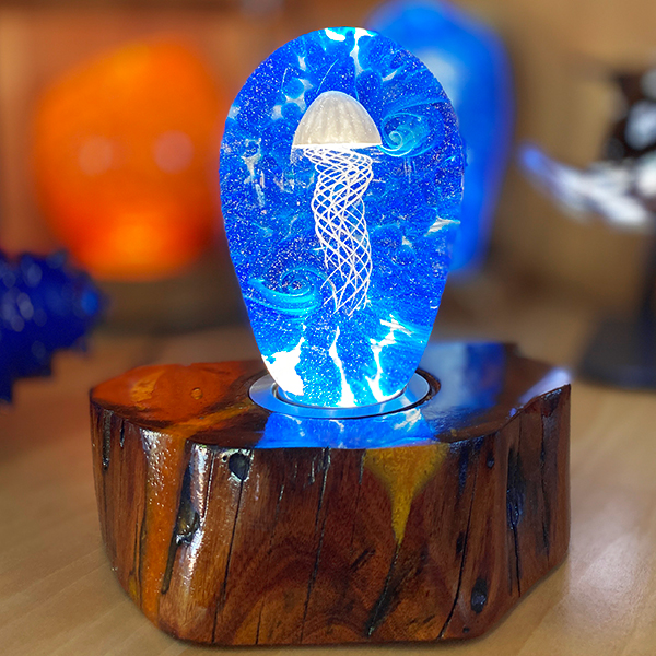 <p>Small Jellyfish<br>Dim: 5.5” tall x 3.5” wide<br> Retail Price: $775.00<br>These are one-of-a-kind pieces. Pictured is the actual art you’ll receive</p>